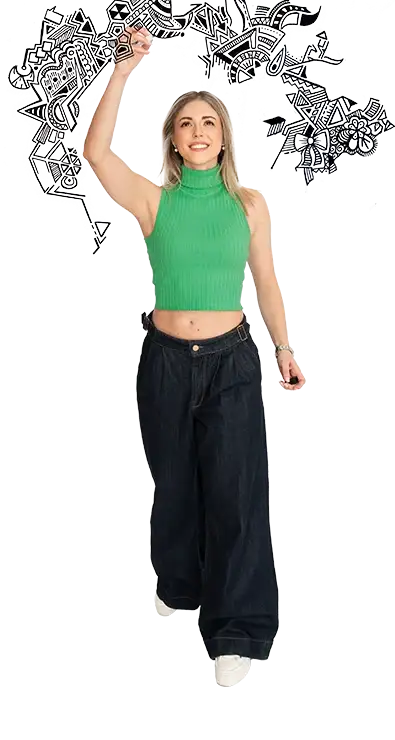 Julia Gorton zeichnet schwungvoll schwarze Kritzeleien in die Luft, trägt ein bauchfreies grünes Oberteil und dunkle Jeans - kreativ, energiegeladen und voller Ausdruck.